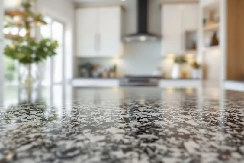 Shiny granite countertop in a kitchen, guide on how to clean granite countertops safely.