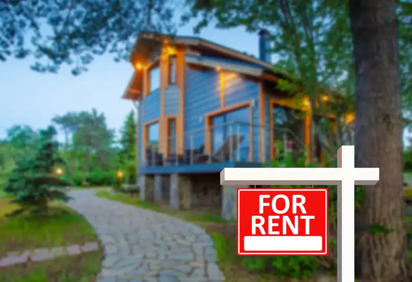 Modern rental home with sign, ready for guests after vacation rental cleaning.