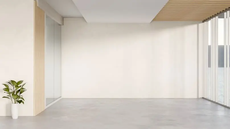 An empty room with a spotless, blank backdrop shows the best way to clean walls effectively.