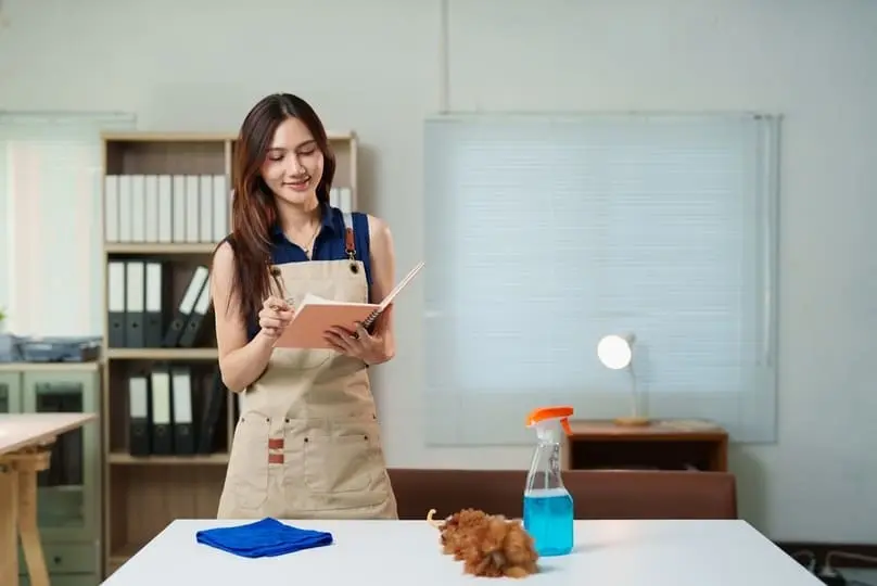 Girl creating an daily cleaning checklist for her home