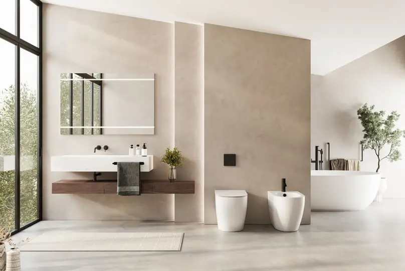 A pristine modern vanity and tub showcasing our tips on how to deep clean a bathroom.