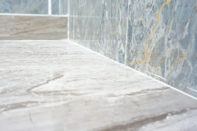 Spotless tile and pristine white grout highlight our guide on how to get rid of green mold.