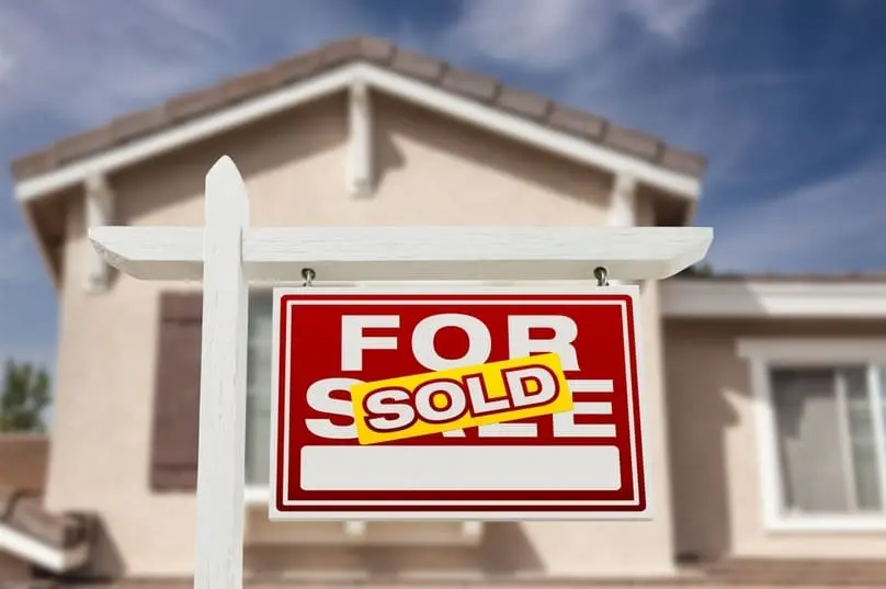 Sold sign in front of a home prepared for sale