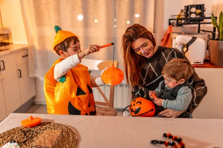 A happy family in Halloween costumes shares tips on how to clean after costume parties.