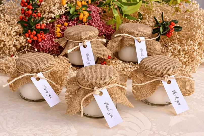 Burlap thank you jars and autumn flowers highlight how to clean before fall guests arrive.