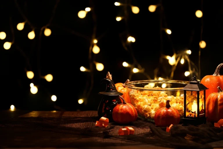 Festive pumpkins and a bowl of popcorn highlight our post halloween cleanup checklist